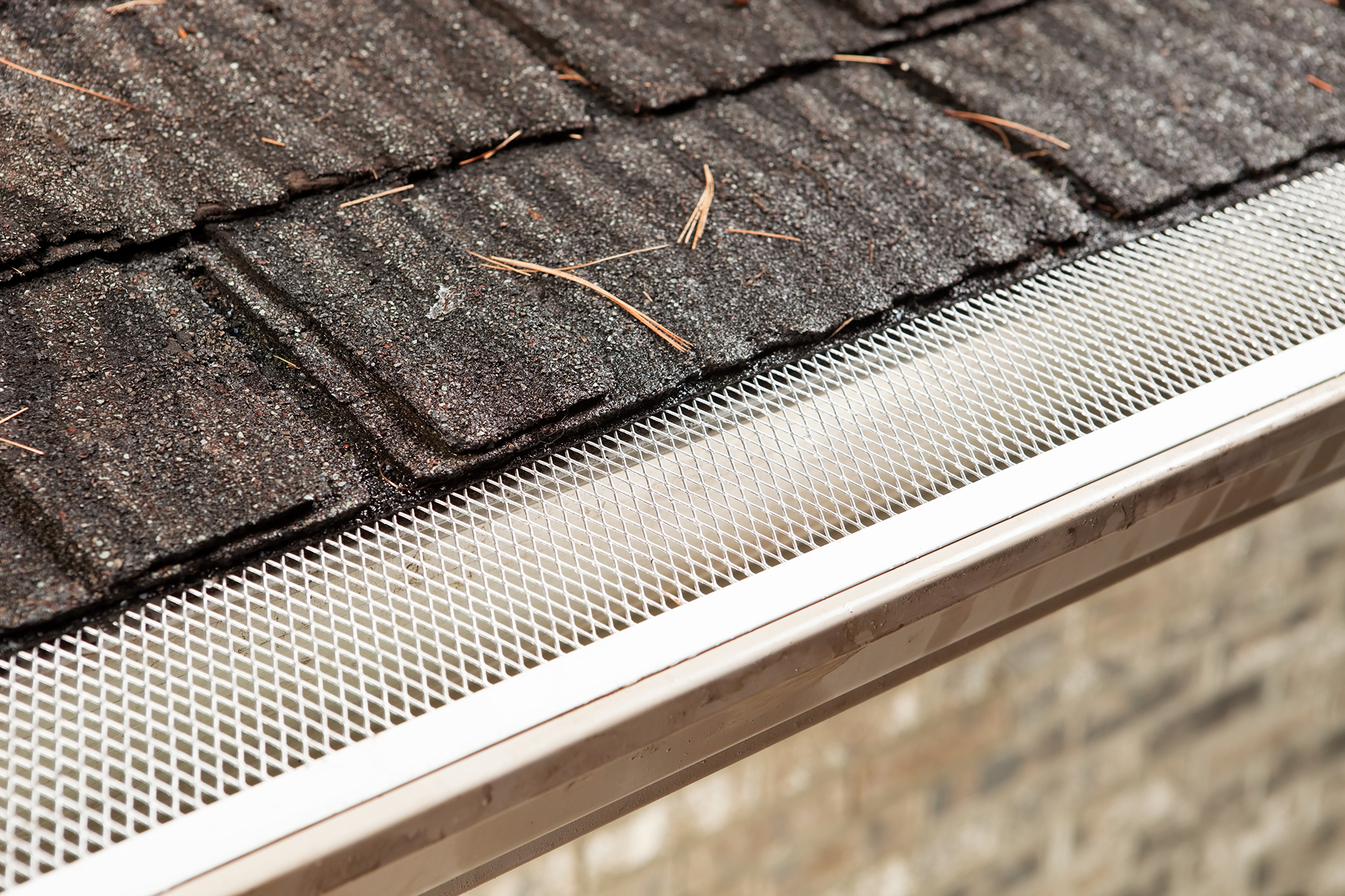 Gutter screen on top of a gutter to ensure large and bulky debris doesn’t get trapped and clog the gutters.