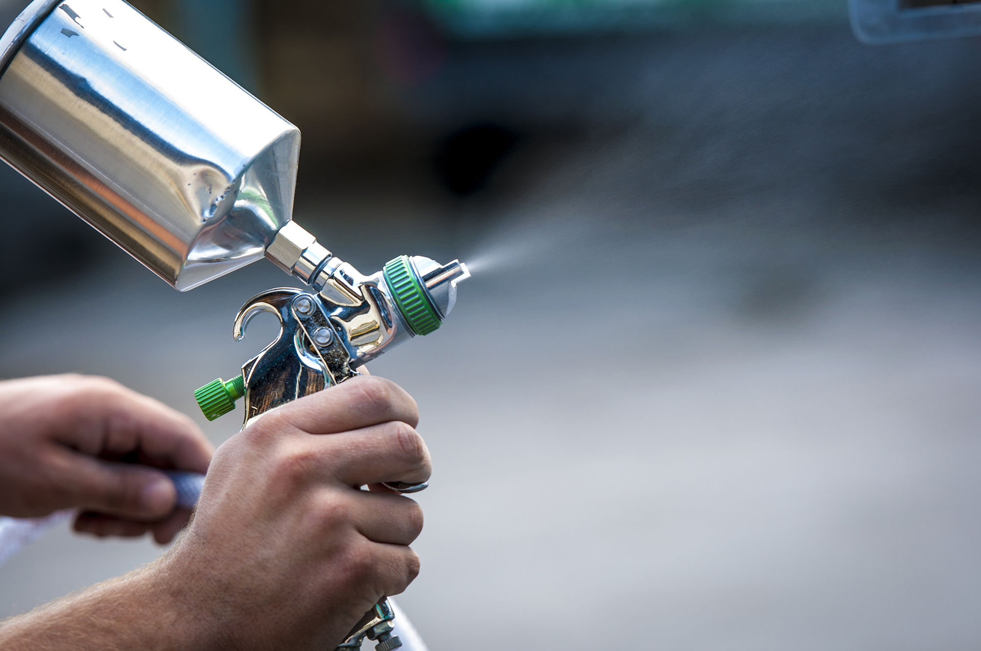 Tool used to help prime or coat wood siding panels before installation on a building or home.