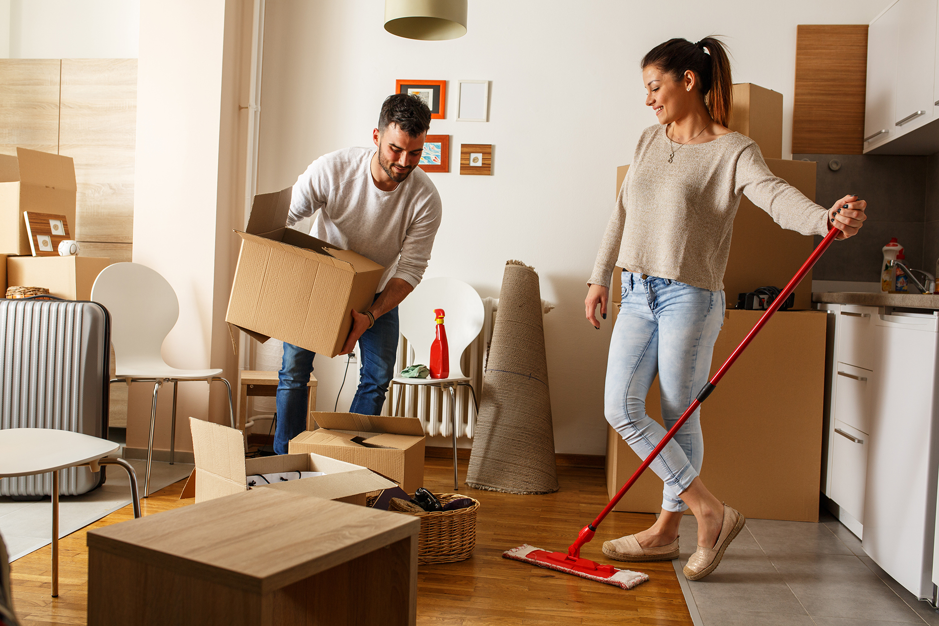 A couple cleaning and decluttering their home