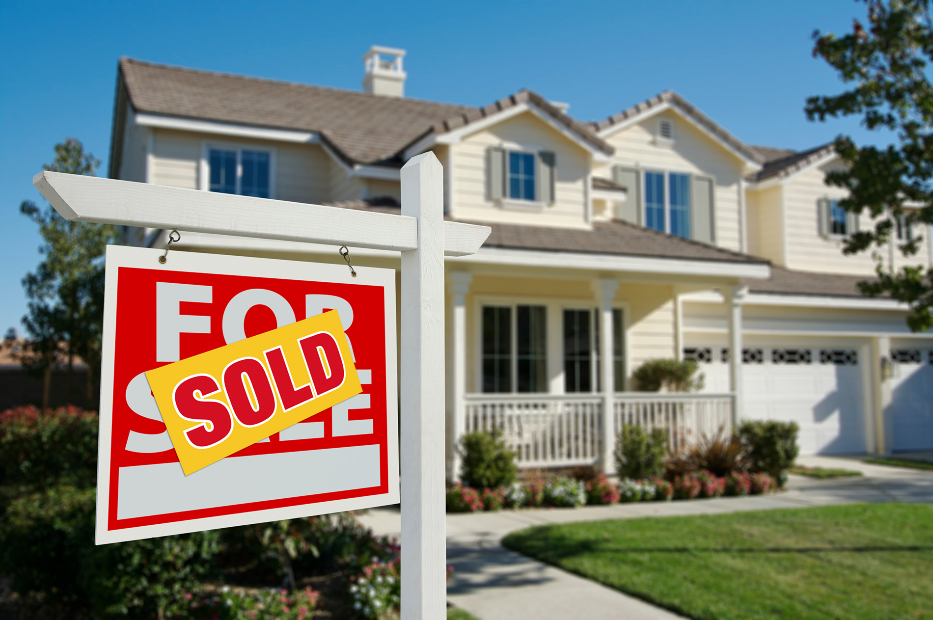 Sold sign in front of a house